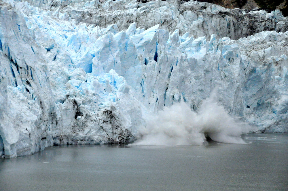 Glacier Bay, Alaska, U.S.A - August 8, 2010 - Glacier calves into the bay due to climate change