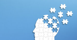 47-Year-Old Mom With Early-Onset Alzheimer's Shares Her First Symptoms medical icon commonly used to represent brain health, cognition, or conditions like Alzheimer's disease and dementia. It features a silhouette of a human head with the brain area depicted as dispersing blocks or leaves, symbolizing memory loss or cognitive decline