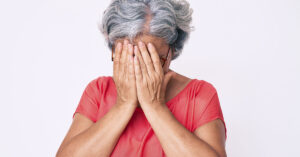 Why 'Sunday Scaries' Hit So Many Americans — And Practical Ways to Feel Calmer Before Monday woman with hands covering her face. Woman stressed