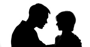 Gen Z Men Increasingly Expect Their Wives to Obey Them. What is happening? Silhouette of a couple in an argument