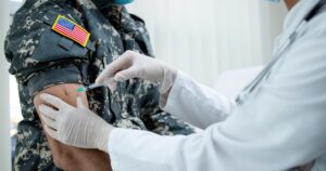 Annual Flu Shot No Longer Mandatory for U.S. Service Members, Pentagon Says American soldier getting vaccine shot during corona virus pandemic. Military vaccination and immunization