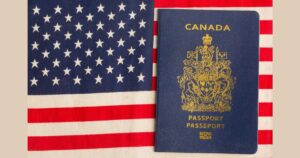 Millions of Americans May Already Be Canadian Citizens. See if You Qualify Canadian passport with the US flag in the background.