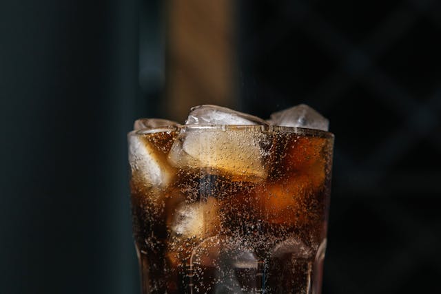 a glass of ice and soda
