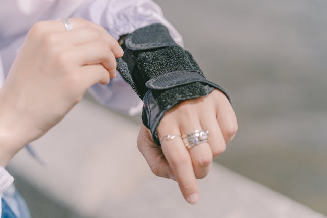 person putting on wrist strap