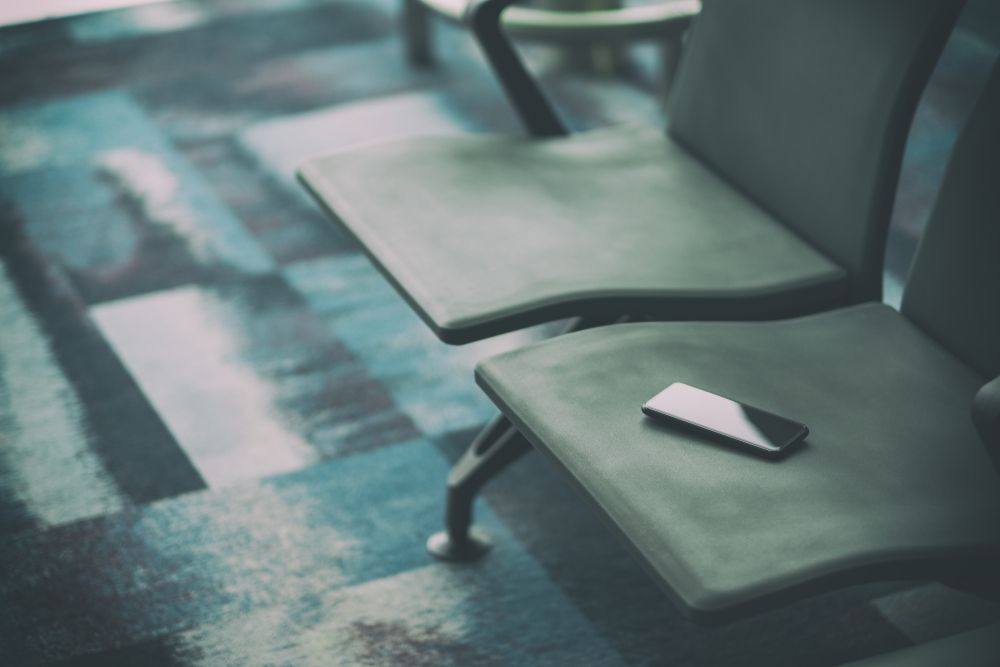 Passenger lost mobile phone on the airport chair 