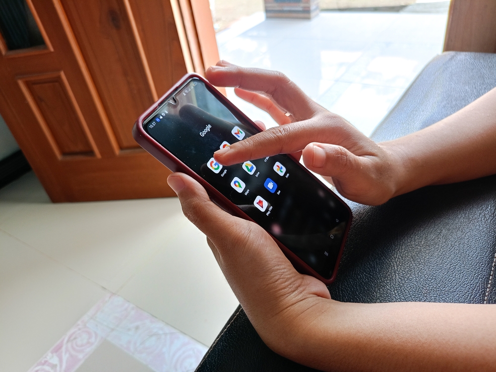 Cilacap Indonesia March 3 2024.A woman's hand holding a smartphone displays the Google application. Google is the main tool of choice as an information seeker