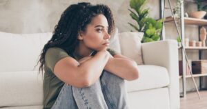 Photo of tired depressed girl dressed khaki t-shirt feeling loneliness indoors house apartment room
