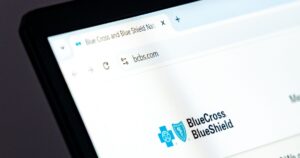 Blue Cross Blue Shield to Start Paying Out $2B in Settlements: How to Claim Yours Blue Cross Blue Shield website homepage displayed on laptop screen. Health insurance company offering coverage plans and medical services