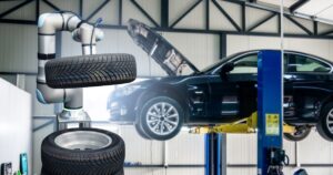 Robot arm works in a car service.