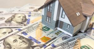 5 States Where You May Be Owed 'Unclaimed Property' Cash house, money and wallet on white. Buying real estate and housing on credit. Mortgage credit lending.
