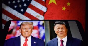 Photos of U.S. President Donald Trump and President of the People's Republic of China Xi Jinping appear on a smartphone screen. 11.04.2025. New York, USA.