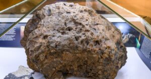The remains of the Chelyabinsk meteorite, which is located in the local history museum in Chelyabinsk, Russia. Cover the exhibit with a glass dome.