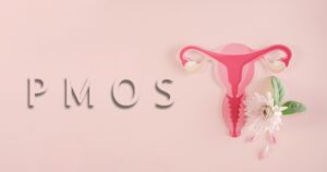 PCOS Is Now Called PMOS — Here's What the Name Change Really Means uterus and pink flowers, female reproductive system , woman health, PMOS, gynecologic and cervix cancer concept
