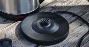9 Appliances You Should Consider Uplugging Every Time You Use Them platform for electric kettle on the table