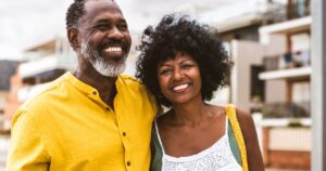 Harvard Doctor Identifies One Thing People Should Do at 50 to Be Healthiest at 80 Beautiful mature black couple of lovers dating at the seaside - Married african middle-aged couple bonding and having fun outdoors, concepts about relationship, lifestyle and quality of life