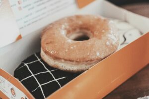 Krispy Kreme $1.6M Settlement: How To Get Yours Before June 22 Delicious glazed donut in a box, perfect for sweet indulgence. Photographed in Bandung.