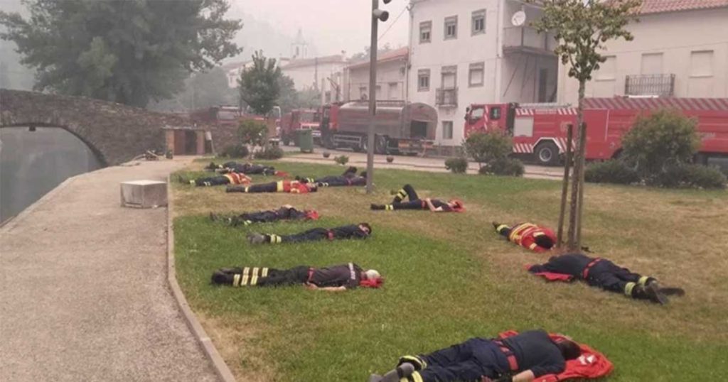The Photo Of Firefighters Laying Across a Lawn That Went Viral