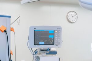 Your Heart May Be Warning You About Cancer Risk Years Early A modern heart rate monitor in a sterile hospital setting, showcasing medical technology.