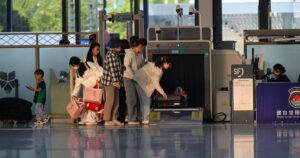 The Shocking Plan To Cut Airport Customs In Sanctuary Cities — What's At Stake Travelers undergo security screening at an airport terminal.