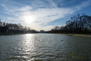 Trump Claims Lincoln Memorial Was Built Backward — and Now Wants to Fix It The Lincoln Memorial Reflecting Pool with serene water and clear sky in Washington DC.