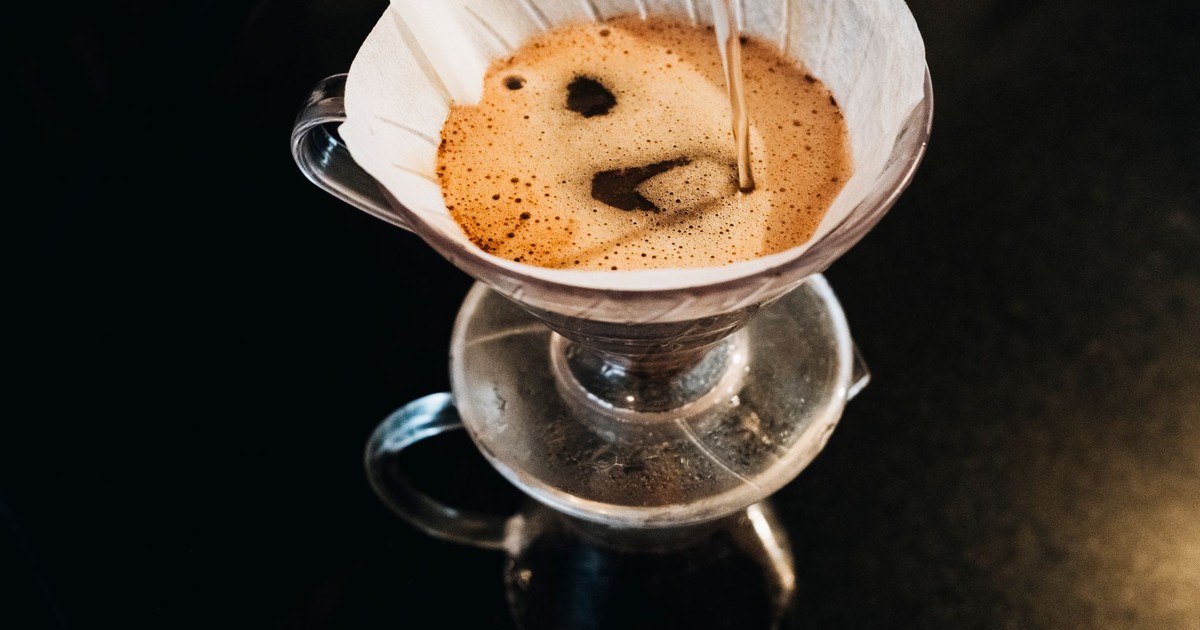 Top view of a pour-over coffee brewing process using a filter dripper set.