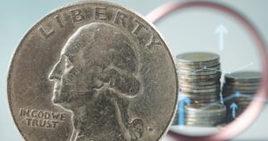 These 1980s Coins Could Be Worth Thousands — Check Before You Spend Close-up of a 1984 US quarter dollar coin, featuring George Washington's profile.