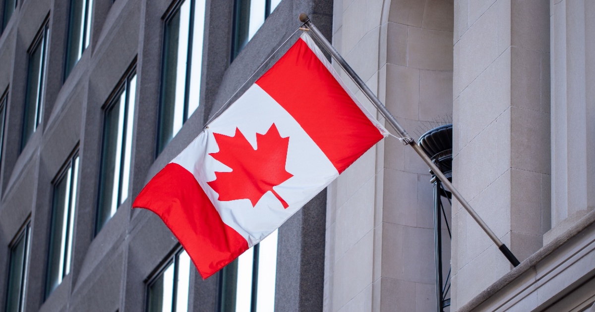 Canadian flag on government building in downtown of Ottawa, Ontario in Canada.
