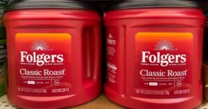 Your Old Coffee Container Makes a Better Bird Feeder Than You'd Think ATLANTA, GEORGIA - SEPTEMBER 1 2025 : Folgers Classic Roast Coffee on a display shelf in an American grocery store supermarket.