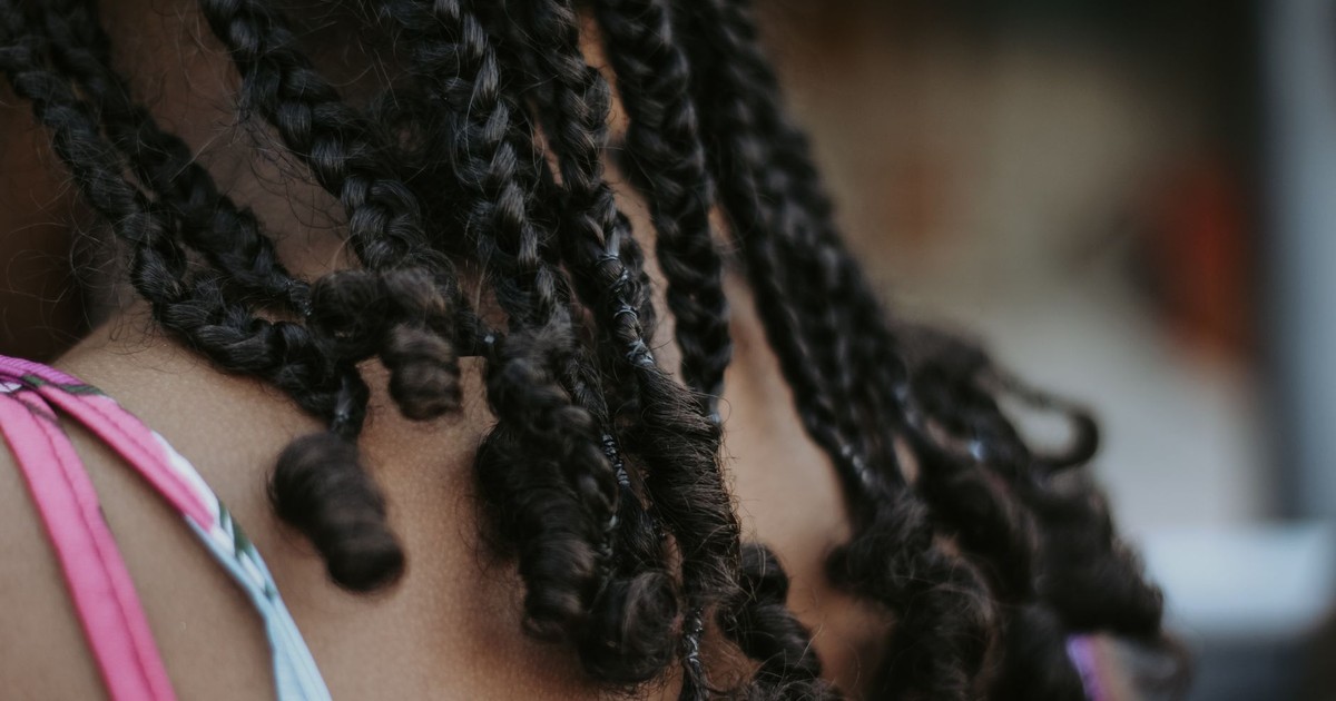 Detailed view of braided hairstyle highlighting texture and style.