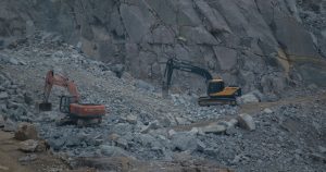 Geologists Say One of the World's Greatest Treasures Is Too Dangerous to Dig up After Latest Find Dynamic construction site featuring excavators working on rocky terrain.