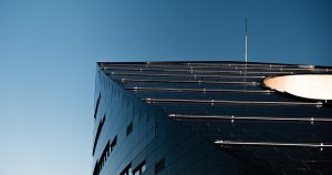 New Solar Windows Generate Electricity Even on Cloudy Days, Researchers Say Low angle shot of a modern building with solar panels in Trondheim, Norway.