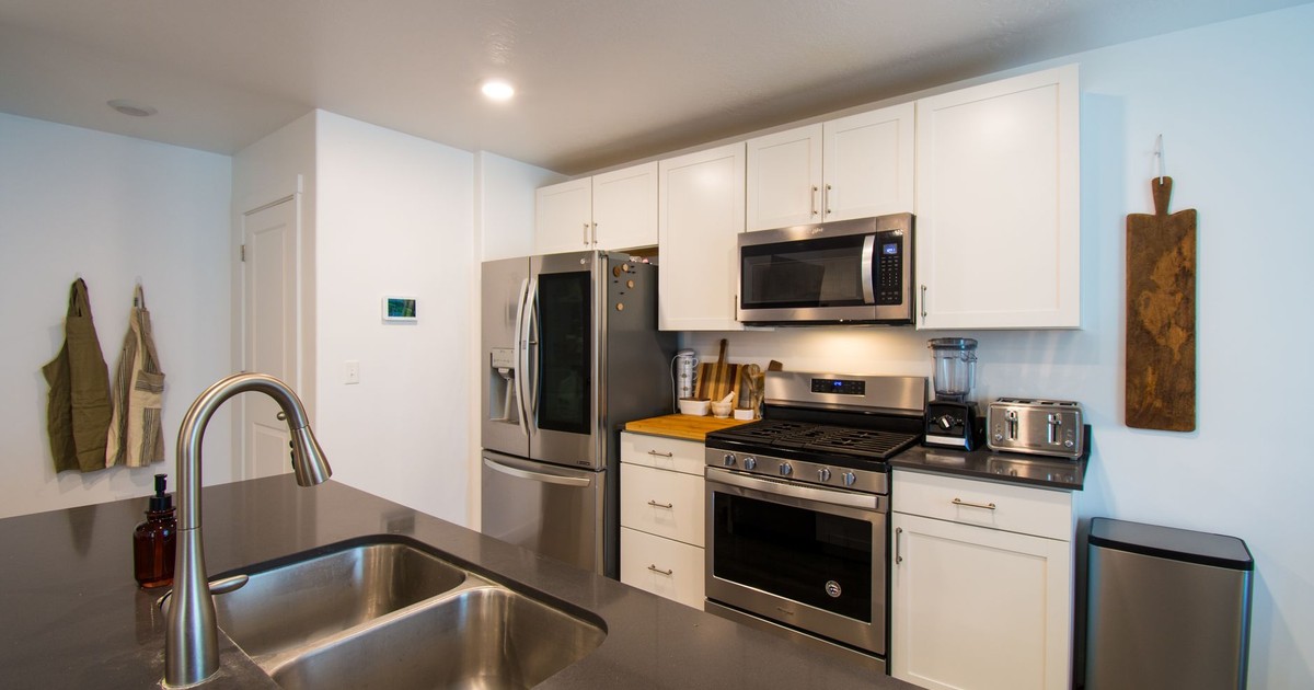 Sleek kitchen design featuring stainless steel appliances and chic cabinetry.
