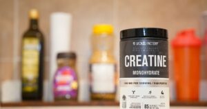 Creatine monohydrate from Jacked Factory displayed on a kitchen counter.