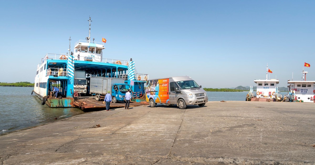 Vehicles boarding a ferry at a sunny harbor with scenic backdrop. Ideal for transportation themes.