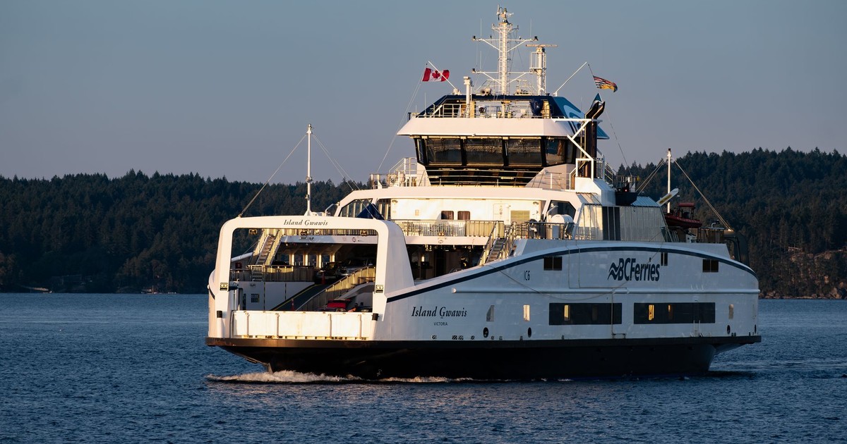 BC Ferries vessel Island Gwawis at sea during sunset in British Columbia, Canada.