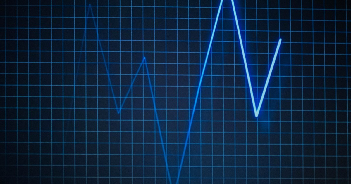 ECG graph on a grid background symbolizing heartbeat and medical data.