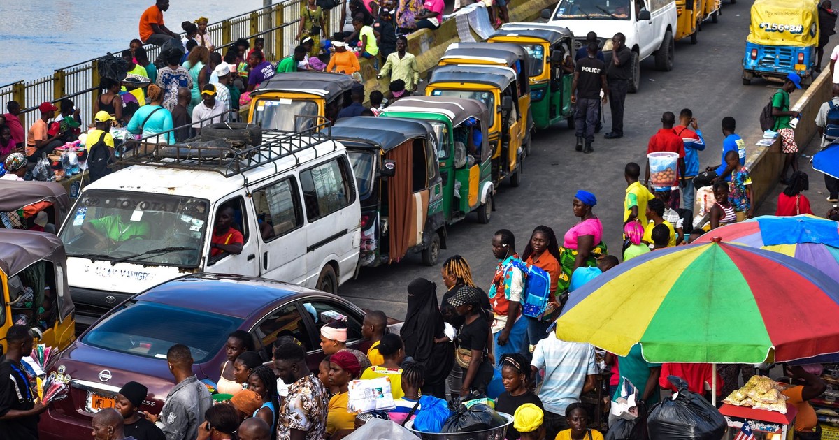 Colorful scene of a bustling market and traffic in Monrovia, Liberia showcasing local life.