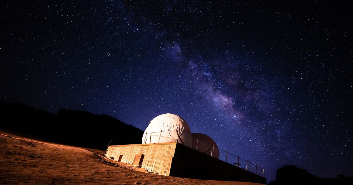Stunning view of the Milky Way galaxy above a desert observatory under a starry night.
