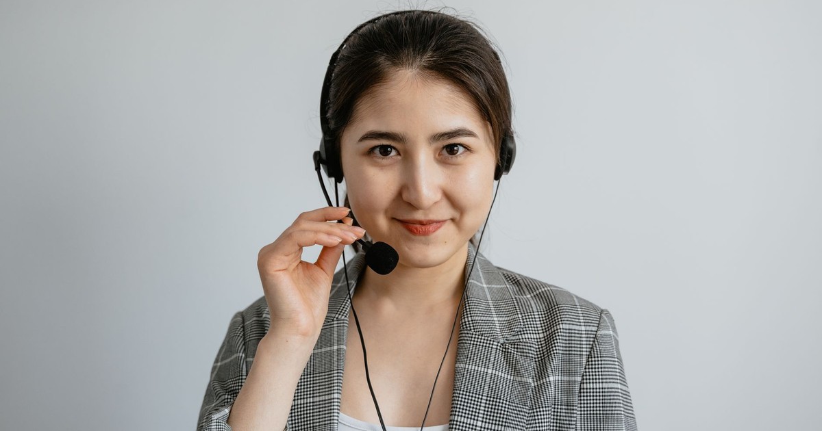 Portrait of a young call center agent confidently working with a headset.